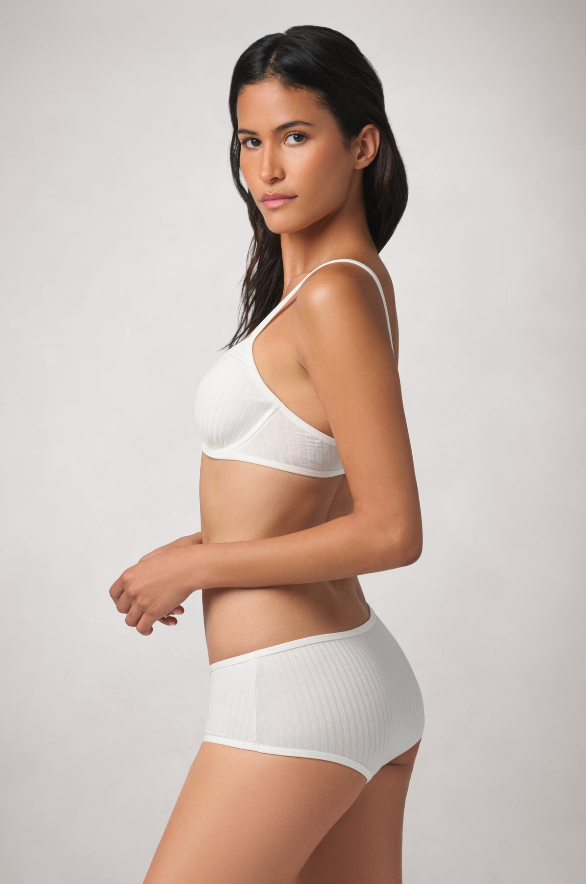 Minimal, fitted back with slim adjustable straps and a clean, understated finish.