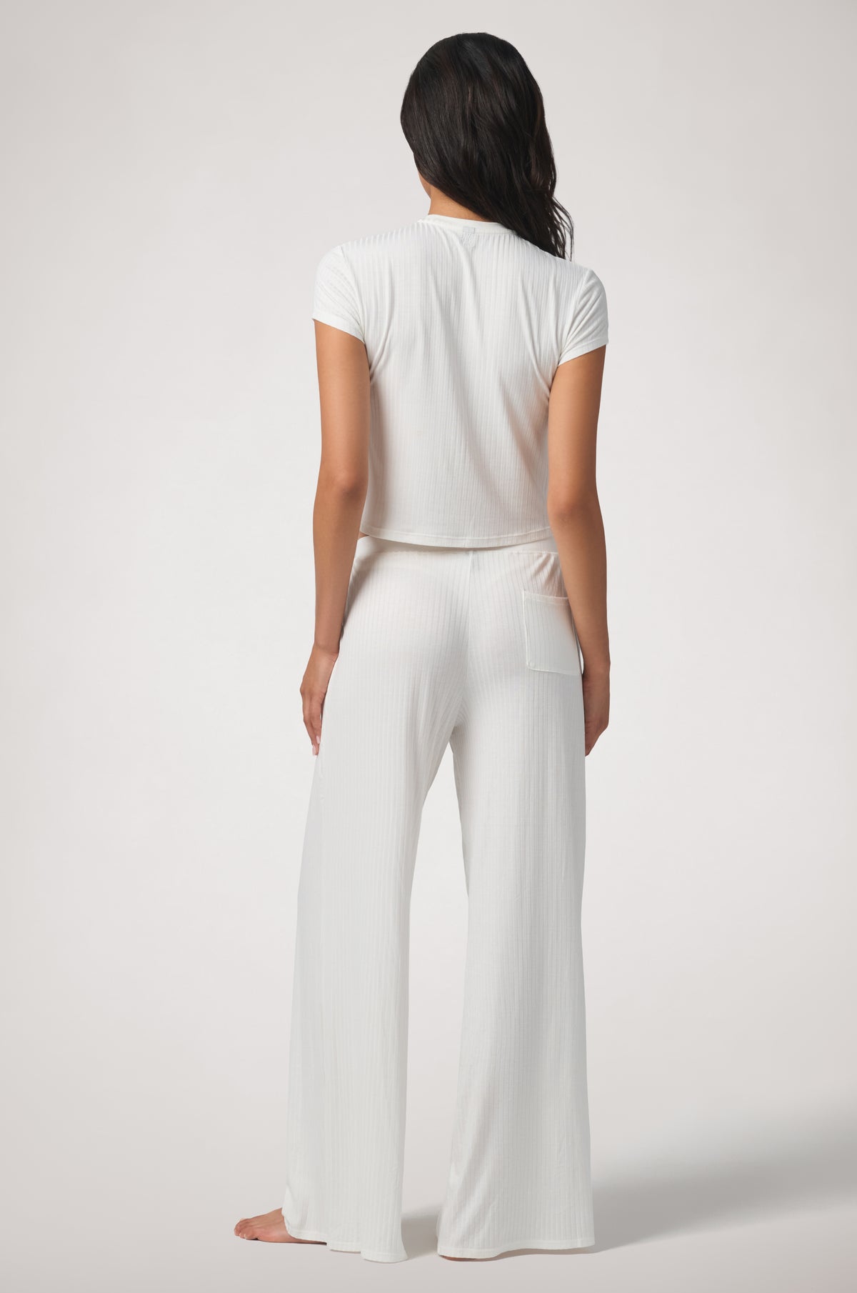 Kiki de Montparnasse Le Boy Track Pant in soft stretch rib knit with a relaxed silhouette and tonal Kiki de Montparnasse embroidery at the back, shown from behind.