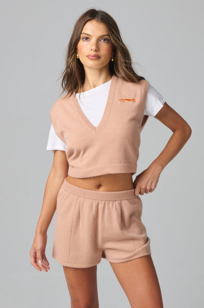 Cropped cashmere knit with a relaxed V-neckline and soft, slightly loose fit through the body. The short length creates a clean, effortless silhouette.