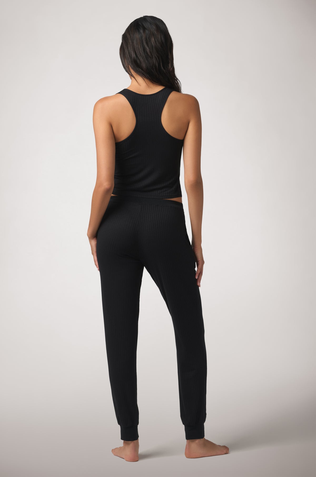 Kiki de Montparnasse Le Boy Jogger in soft black stretch rib knit with racer tank, back.