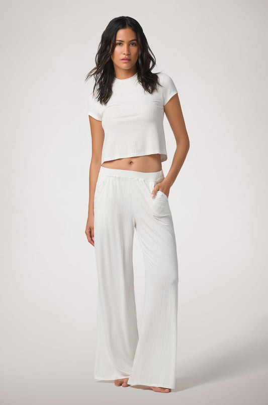 Kiki de Montparnasse Le Boy Track Pant in soft stretch rib knit with a relaxed silhouette and fabric-covered hip buttons, shown from the front.
