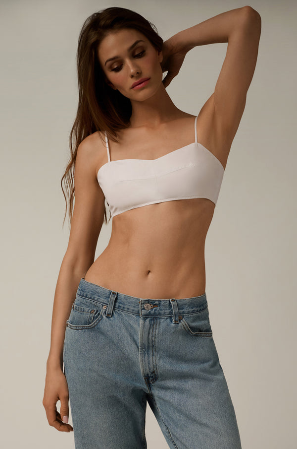 white poplin bandeau top, model wearing jeans