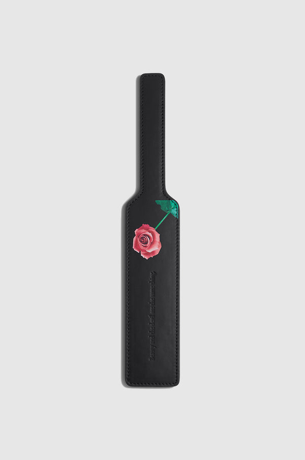Black paddle with red and green rose imagery 