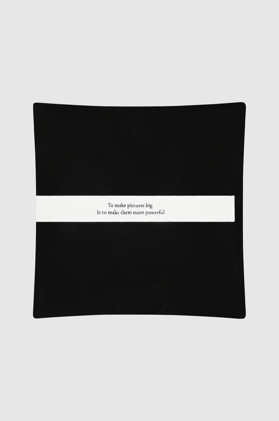 black leather sham featuring "To make pictures big is to make them powerful" - a quote attributed to Mapplethorpe.