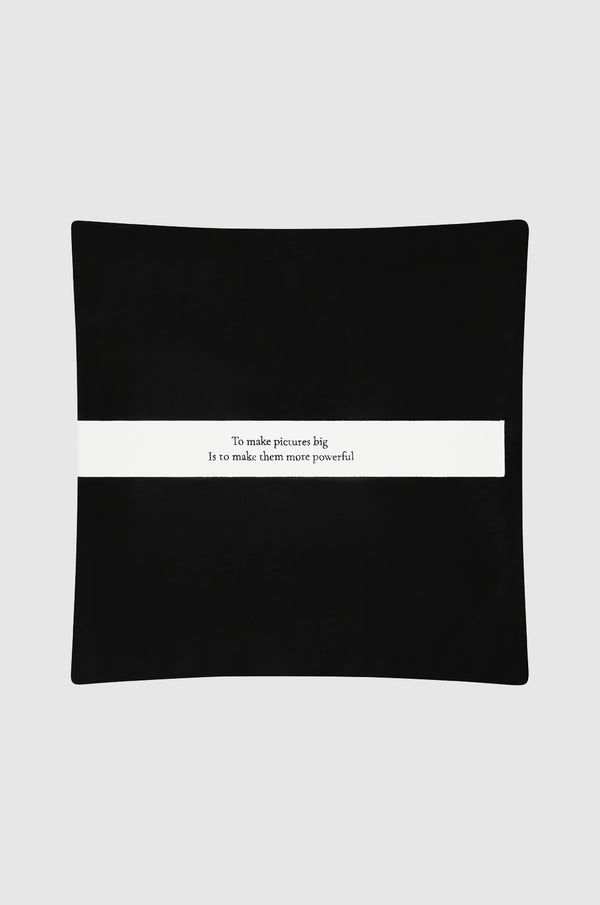 black leather sham featuring "To make pictures big is to make them powerful" - a quote attributed to Mapplethorpe.