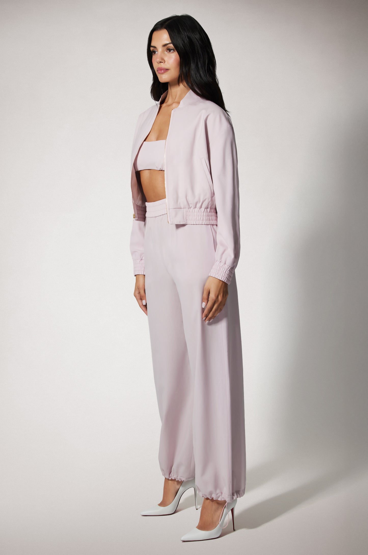 Light Pink Cropped Cinched End Mock Neck Gold Zip Up Bomber Jacket and Pant Side