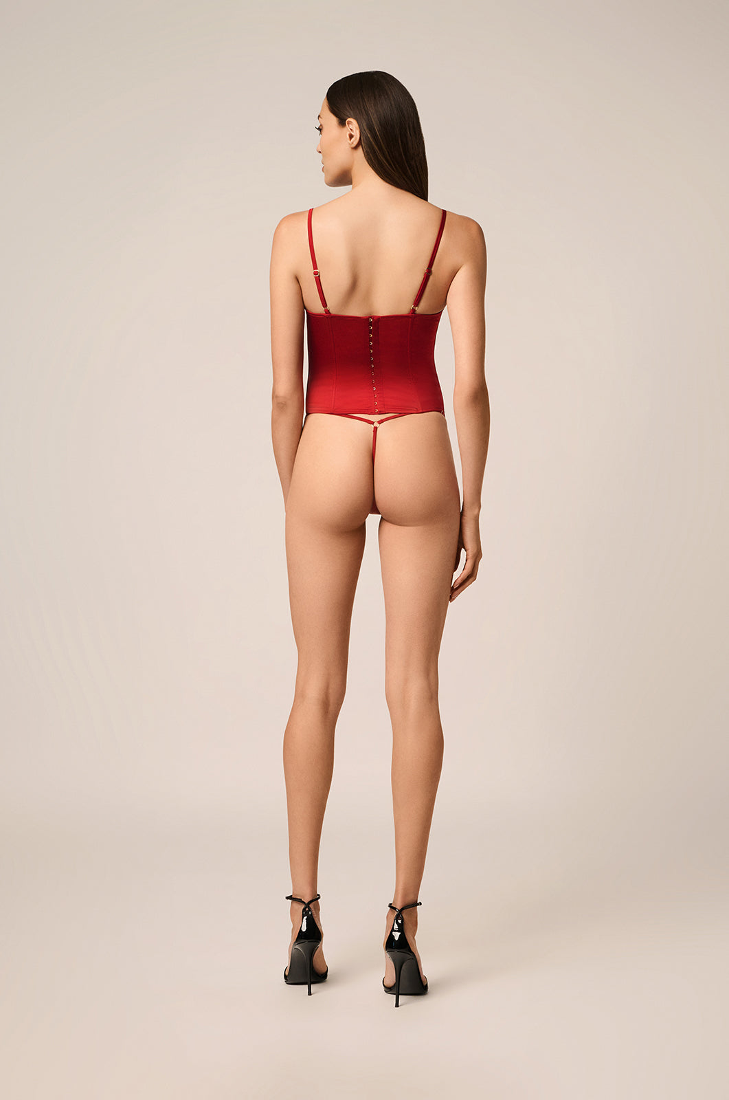 Silk stretch bustier top with adjustable straps, hook, and eye back closure back view