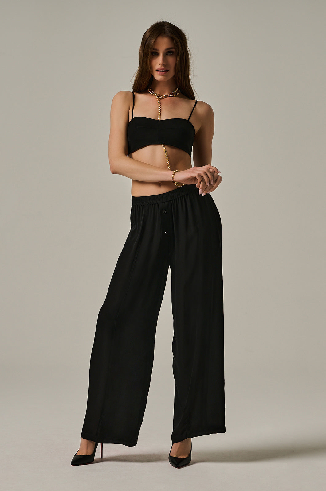 Long black Georgette silk boxer pant  with black button closure in front. Elastic waistband and wide legged
