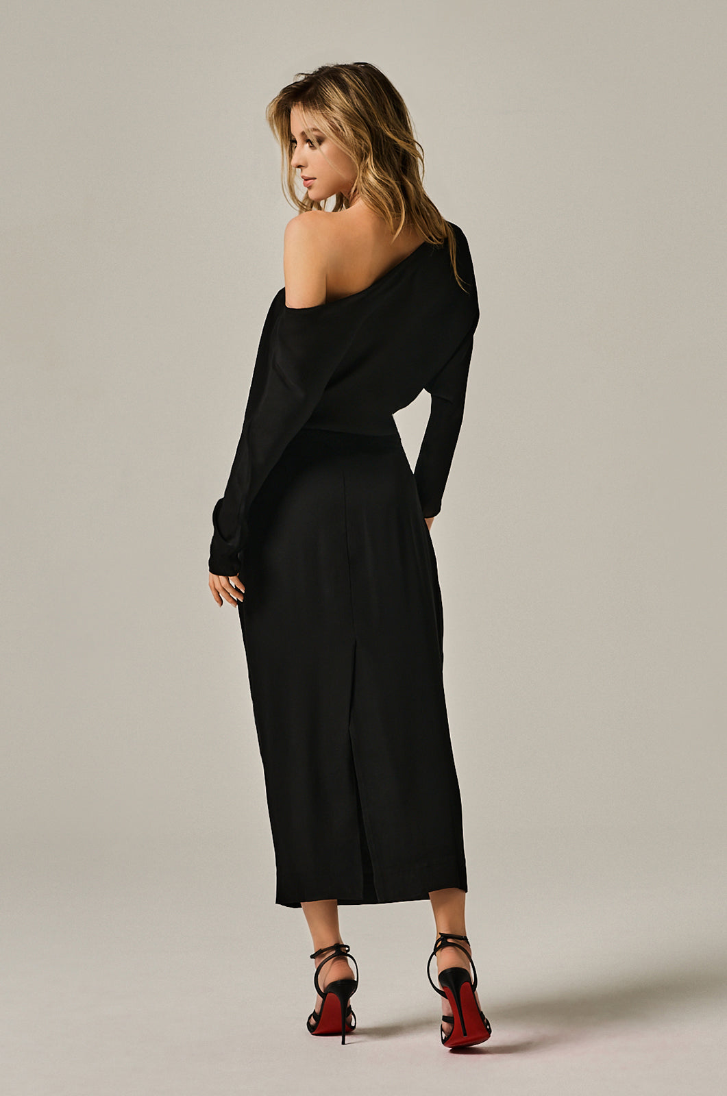 Silk black georgette off shoulder on left side dress. Center back slit