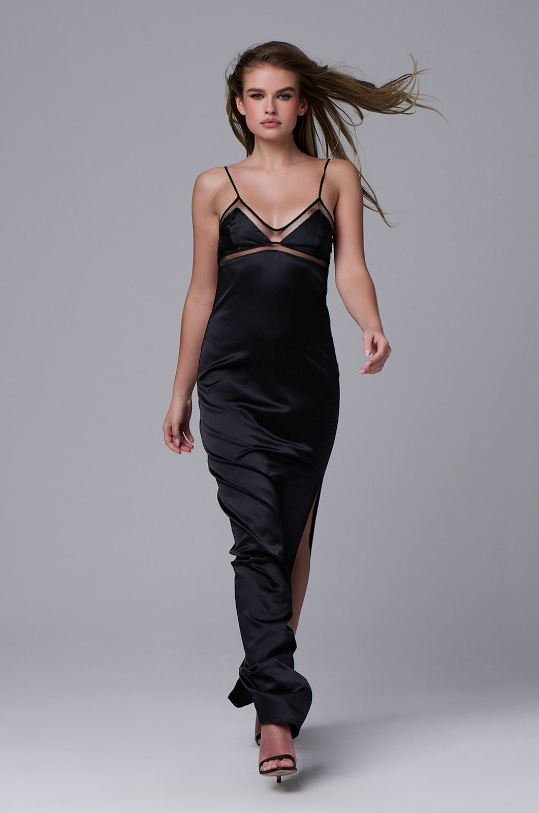 Triangular v-neck silk maxi slip dress with sheer bust outlining and thin straps front view